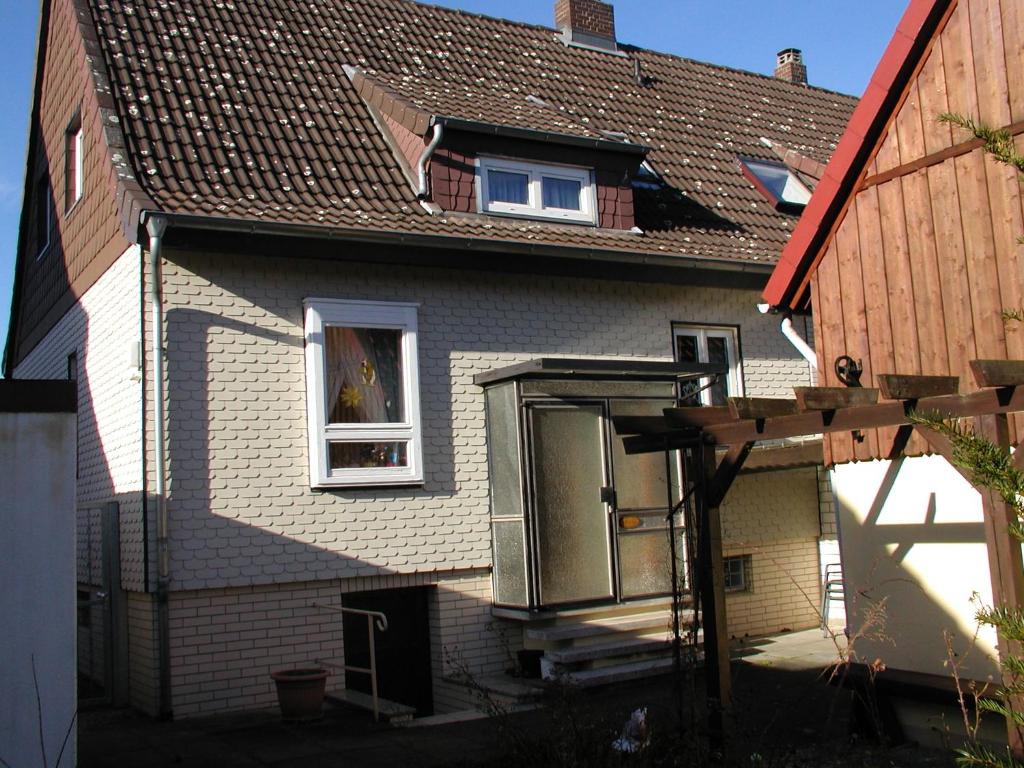 a house with a window with a dog in it at Haus an der Radau in Bad Harzburg