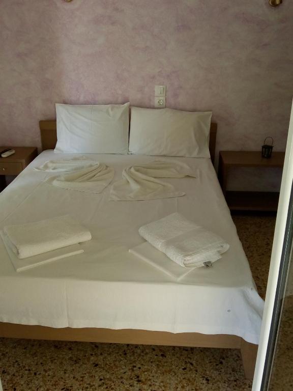 Postel nebo postele na pokoji v ubytování Hotel Ion