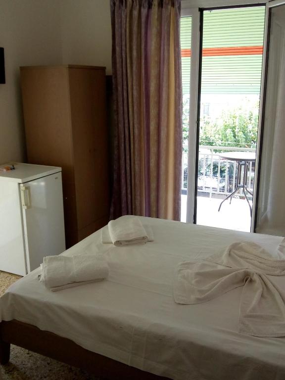 Postel nebo postele na pokoji v ubytování Hotel Ion