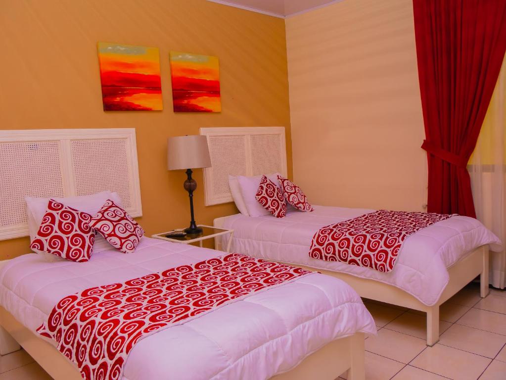 Postel nebo postele na pokoji v ubytování Hotel Bamboo Aeropuerto
