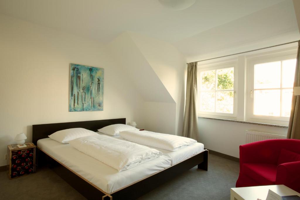 Ένα ή περισσότερα κρεβάτια σε δωμάτιο στο Hotel Zumnorde Am Anger