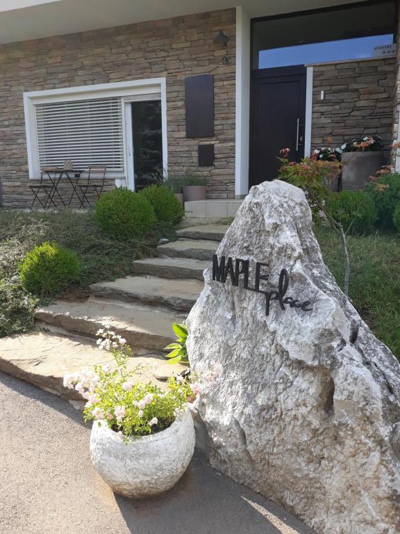 a rock with the word wife written on it at MAPLE place in Pivka