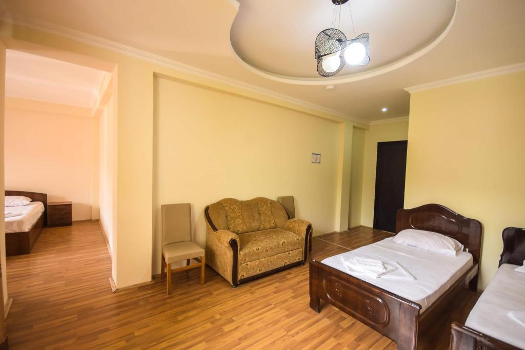 Postel nebo postele na pokoji v ubytování Hotel Otsneba