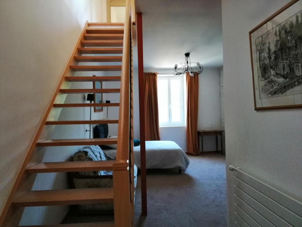 Postel nebo postele na pokoji v ubytování Chambres d´Hôtes Le Cèdre Bleu