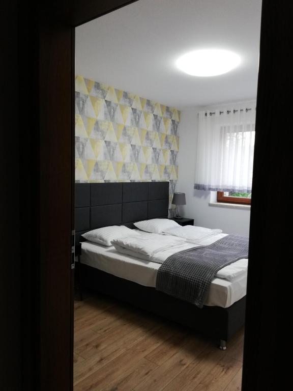 Posteľ alebo postele v izbe v ubytovaní Gdynia Orlowo Honey Apartment