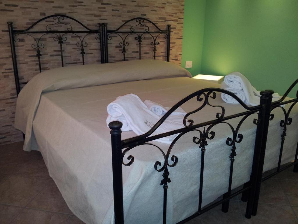 Postel nebo postele na pokoji v ubytování B&B 7Cento Ulivi