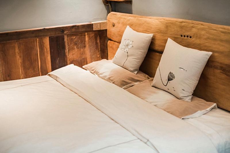 Postel nebo postele na pokoji v ubytování Yunlu Lianxin Guesthouse
