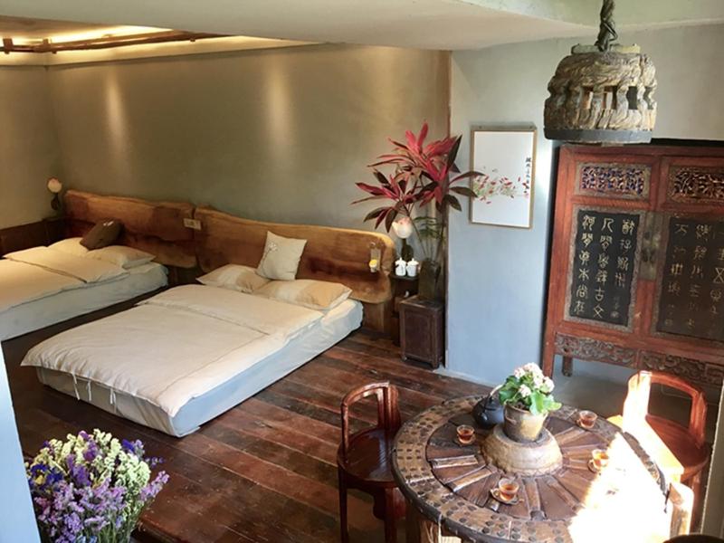 Postel nebo postele na pokoji v ubytování Yunlu Lianxin Guesthouse