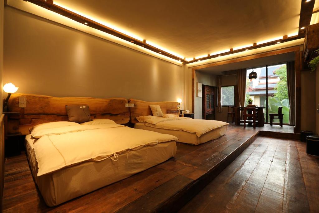 Postel nebo postele na pokoji v ubytování Yunlu Lianxin Guesthouse