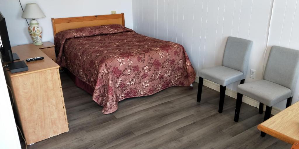 Postel nebo postele na pokoji v ubytování Sherwood Inn and Motel Charlottetown