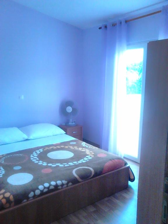 Posteľ alebo postele v izbe v ubytovaní Apartmani Emily