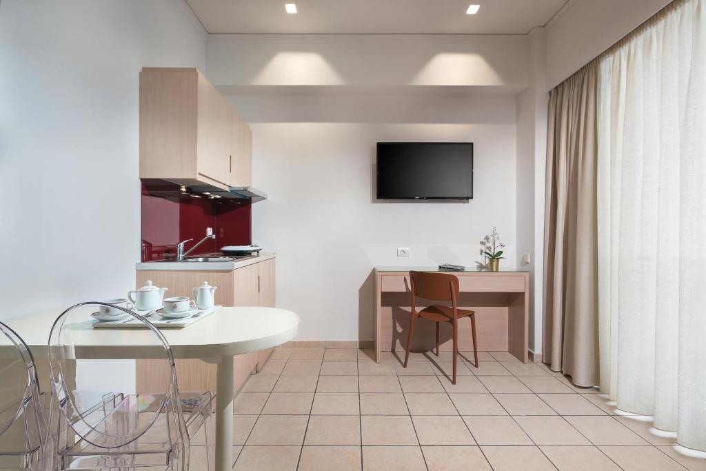 TV a/nebo společenská místnost v ubytování Alexandra Hotel&Apartments