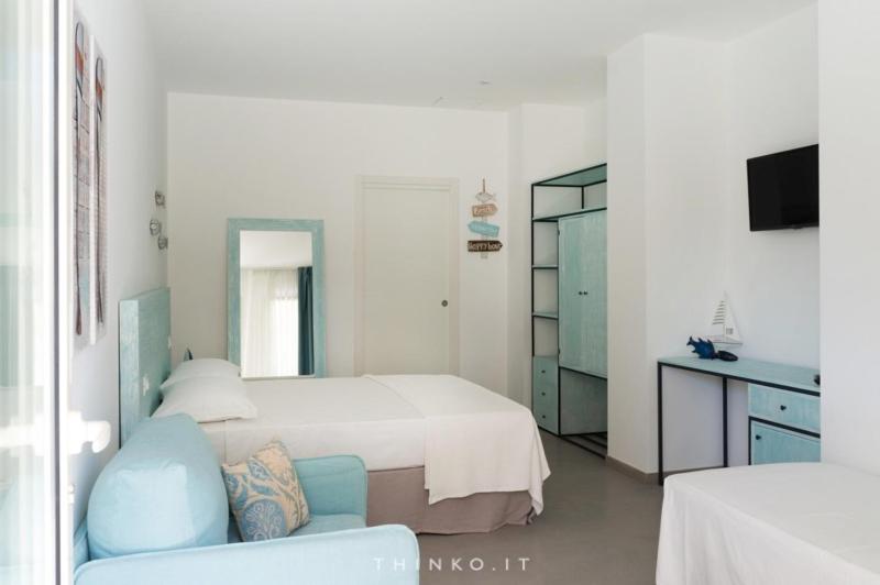 Postel nebo postele na pokoji v ubytování Hotel Universo