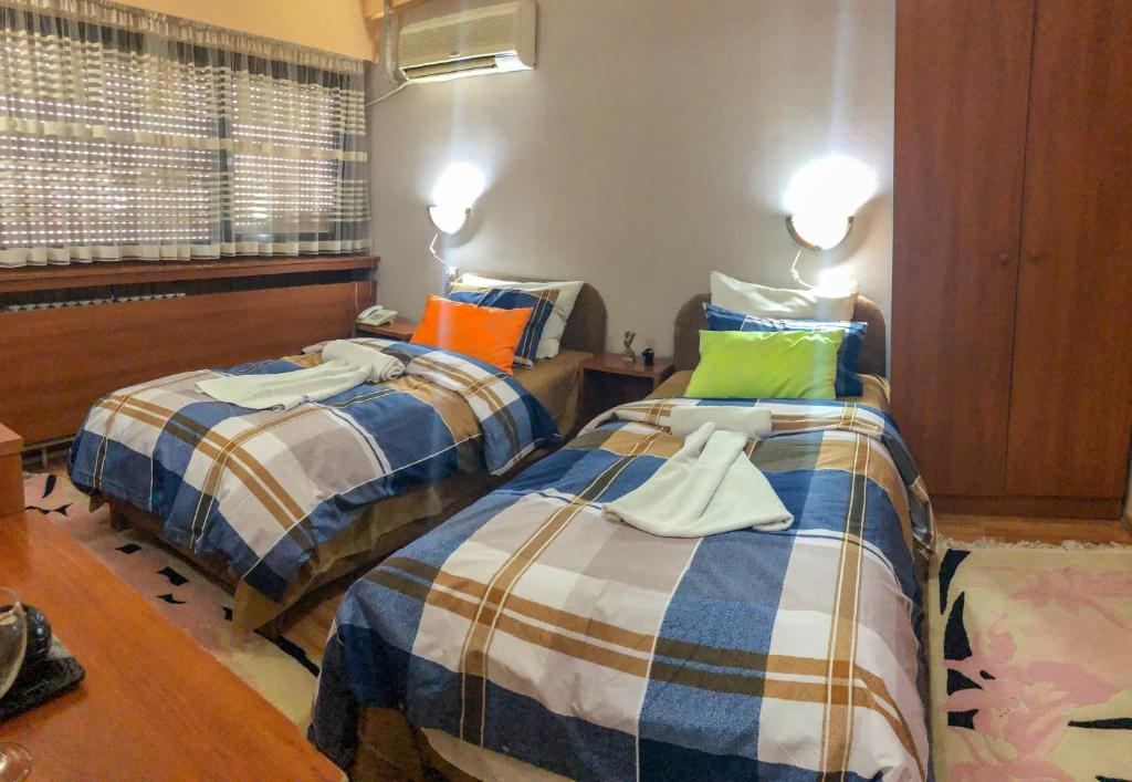 Postel nebo postele na pokoji v ubytování Hotel Square