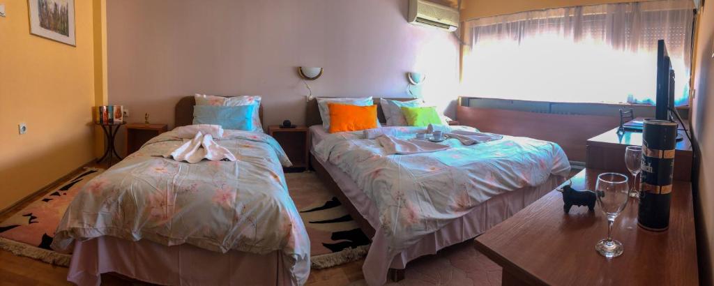 Postel nebo postele na pokoji v ubytování Hotel Square