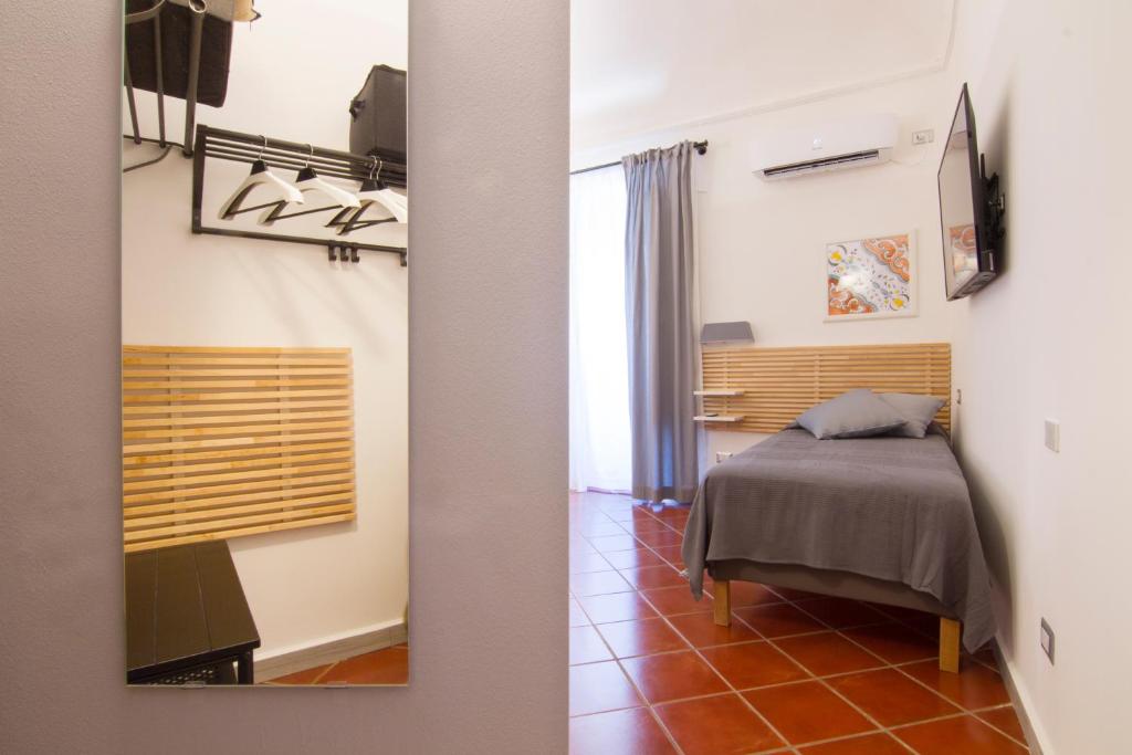 Postel nebo postele na pokoji v ubytování Residenza Normanna