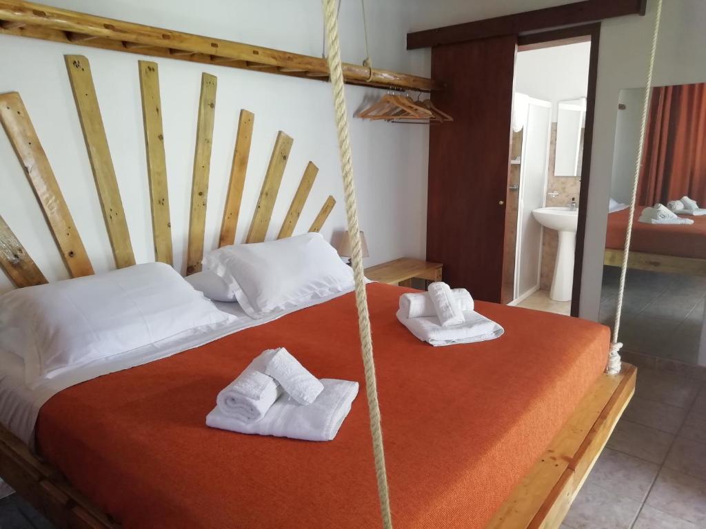 a bedroom with a bed with towels on it at Agriturismo Massaro Pietro in Otranto