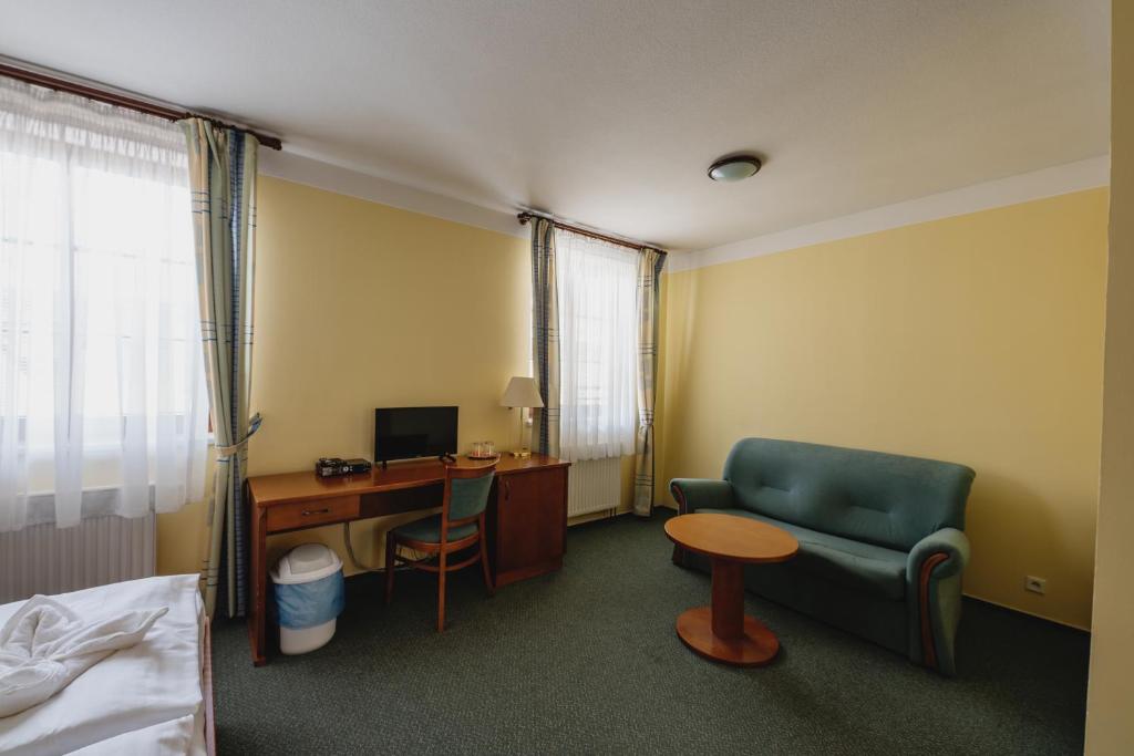 TV a/nebo společenská místnost v ubytování Hotel Taverna
