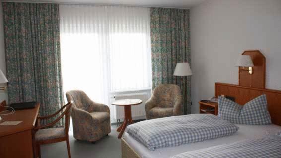 Postel nebo postele na pokoji v ubytování Hotel Herbstein