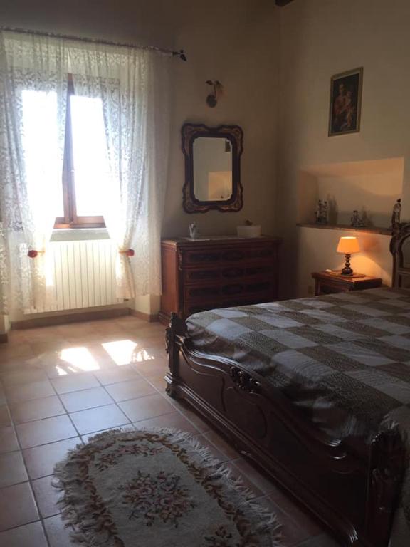 Postel nebo postele na pokoji v ubytování Antico Casale Edifizio