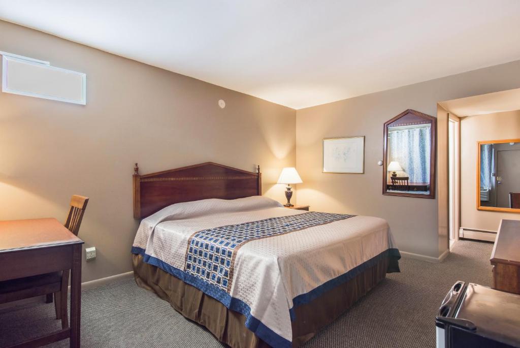 Postel nebo postele na pokoji v ubytování Knights Inn Amsterdam