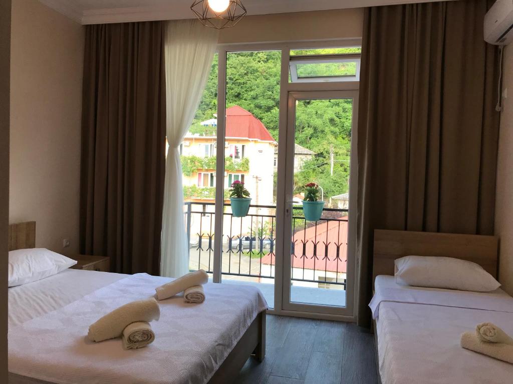 Postel nebo postele na pokoji v ubytování Hotel CHARLI