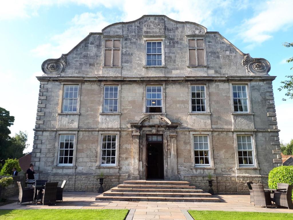 an old stone building with a front door at Hellaby Hall Hotel; BW Signature Collection in Hellaby