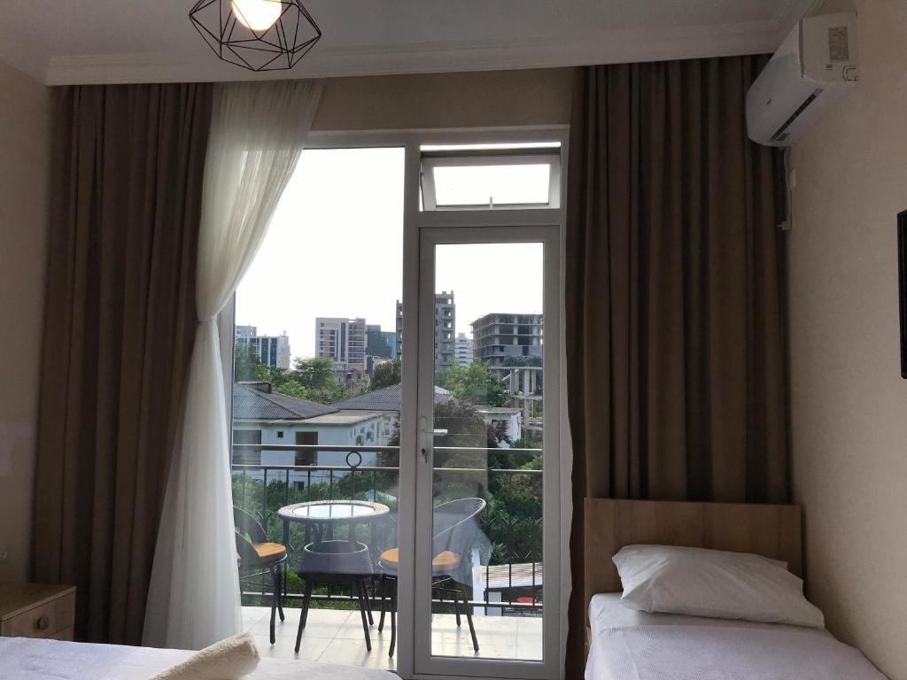 Postel nebo postele na pokoji v ubytování Hotel CHARLI