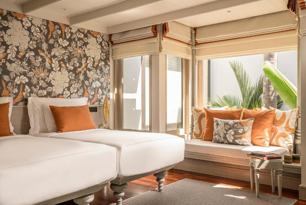 Ein Bett oder Betten in einem Zimmer der Unterkunft Anantara Mai Khao Phuket Villas