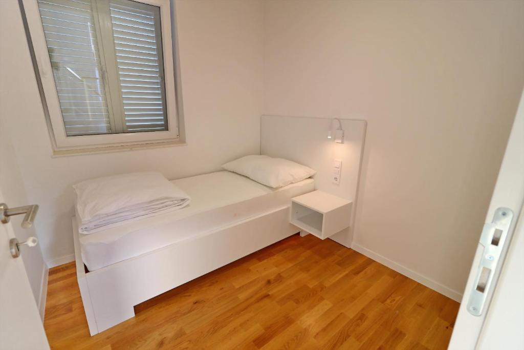 Posteľ alebo postele v izbe v ubytovaní Villa Dalmatinka