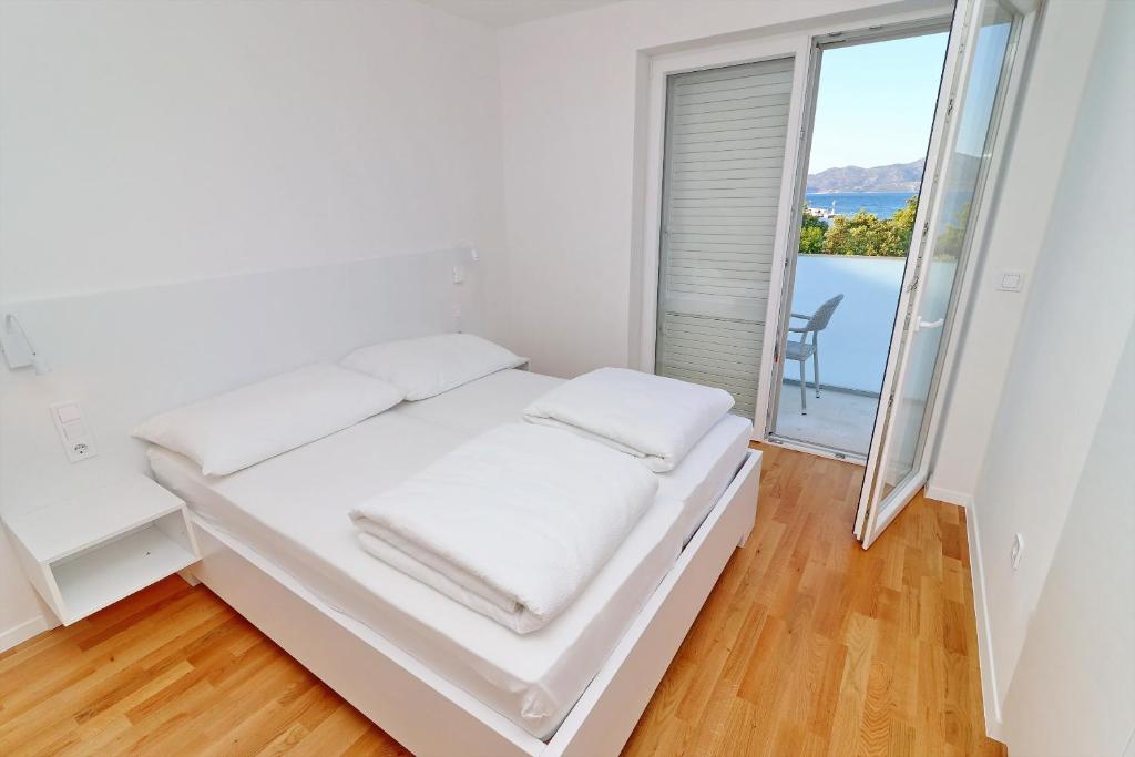 Posteľ alebo postele v izbe v ubytovaní Villa Dalmatinka