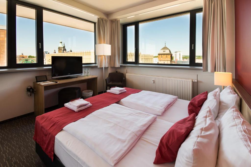 Postel nebo postele na pokoji v ubytování Biendo Hotel