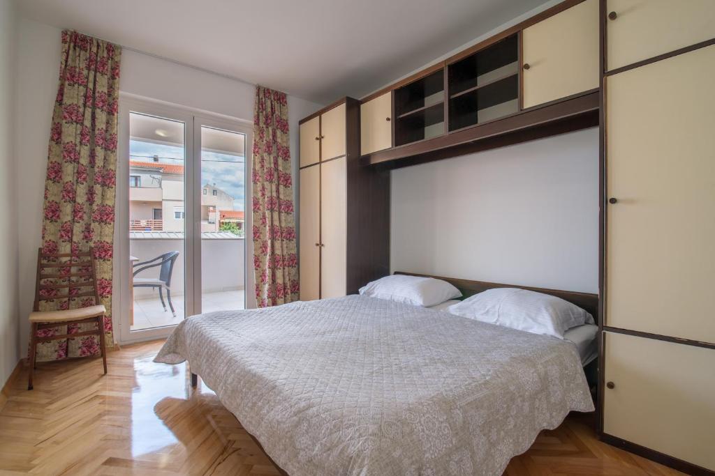 Posteľ alebo postele v izbe v ubytovaní Apartmani Drago