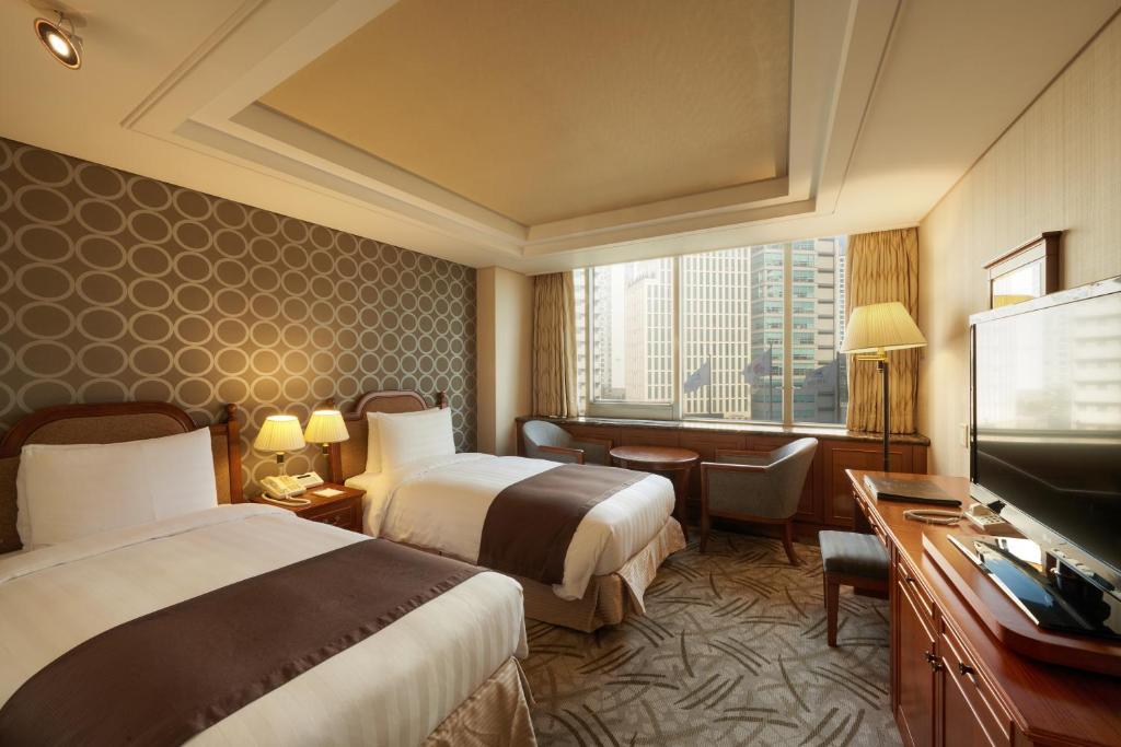 Cama ou camas em um quarto em Seoul Riviera Hotel