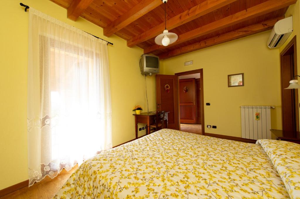 Posteľ alebo postele v izbe v ubytovaní Agriturismo Lis Rosis