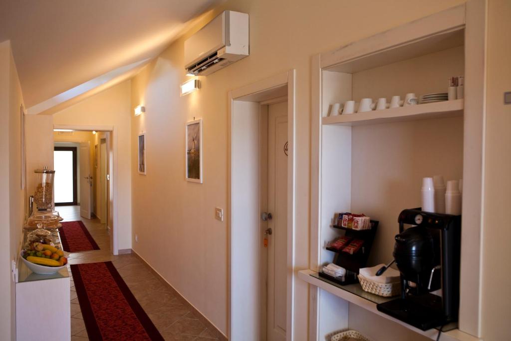 Příslušenství pro přípravu čaje a kávy v ubytování B&B 7Cento Ulivi