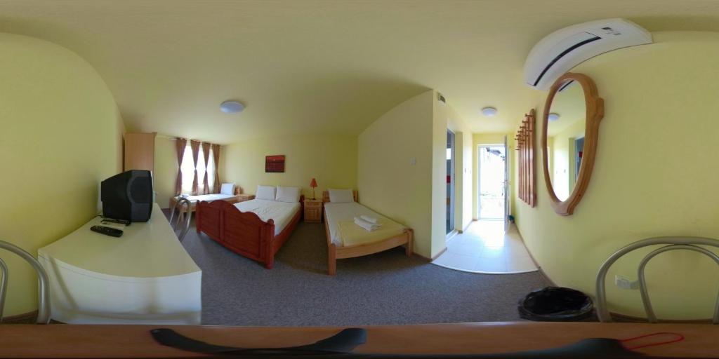Postel nebo postele na pokoji v ubytování Daskalov Bungalows