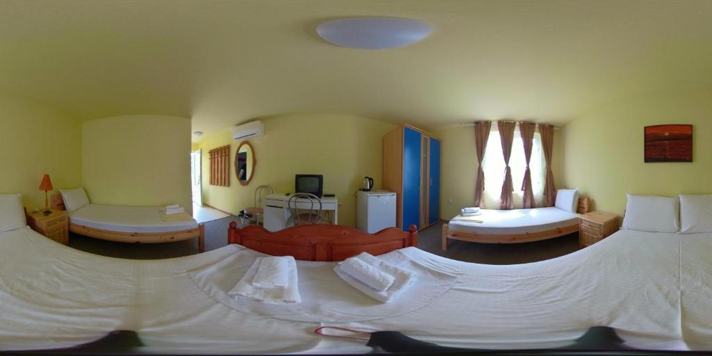 Postel nebo postele na pokoji v ubytování Daskalov Bungalows