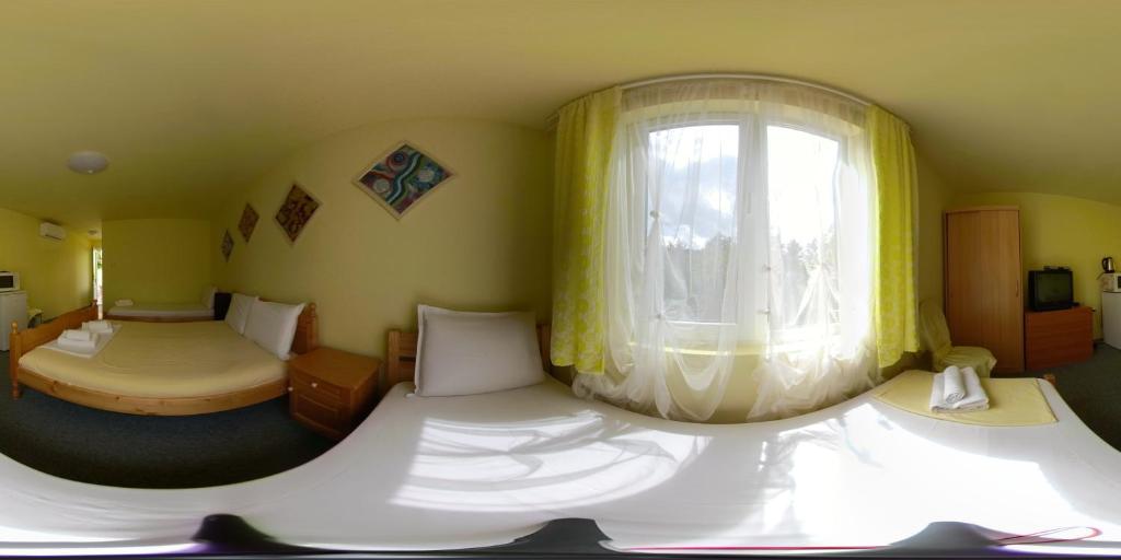 Postel nebo postele na pokoji v ubytování Daskalov Bungalows