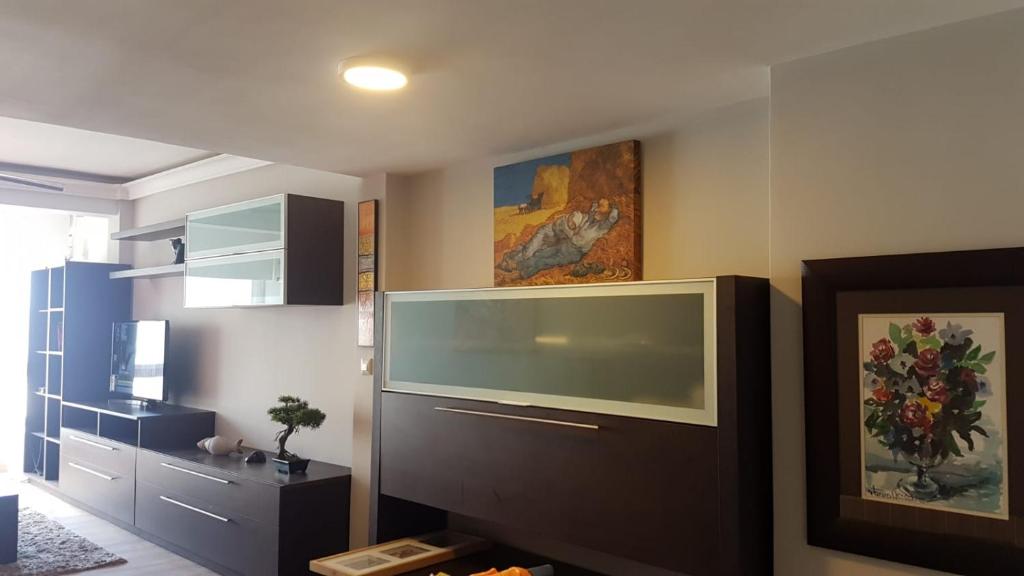 TV a/nebo společenská místnost v ubytování Dúplex Céntrico con Vistas al Mar