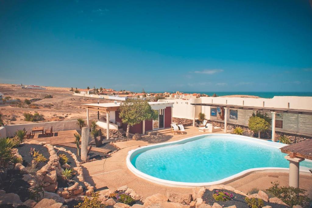 The swimming pool at or close to Bungalow - Fuego - Surf & Yoga Villa