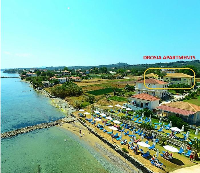 an aerial view of a beach with a resort at Drosia Apartments in Kypseli