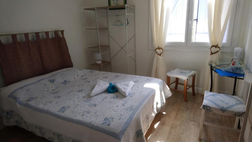 Postel nebo postele na pokoji v ubytování Hotel au Charme du Levat