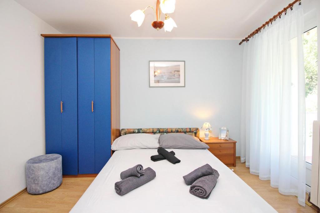 Postel nebo postele na pokoji v ubytování Apartments Alex