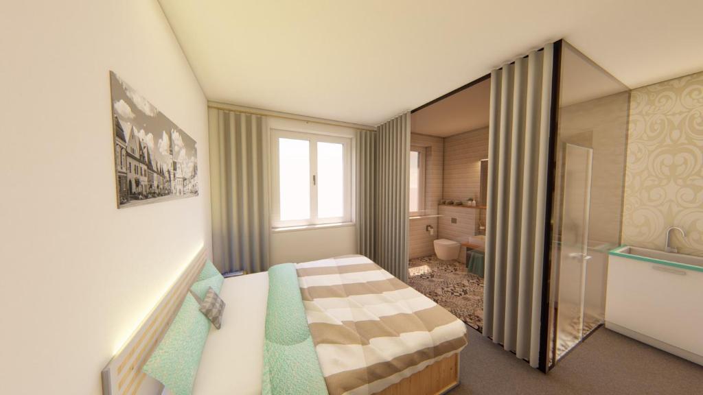 1 dormitorio con 1 cama y baño con bañera en Centrum Apartmán Armida en Bardejov