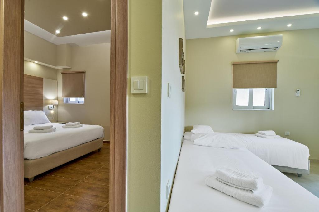 Posteľ alebo postele v izbe v ubytovaní Emmanouela's Apts