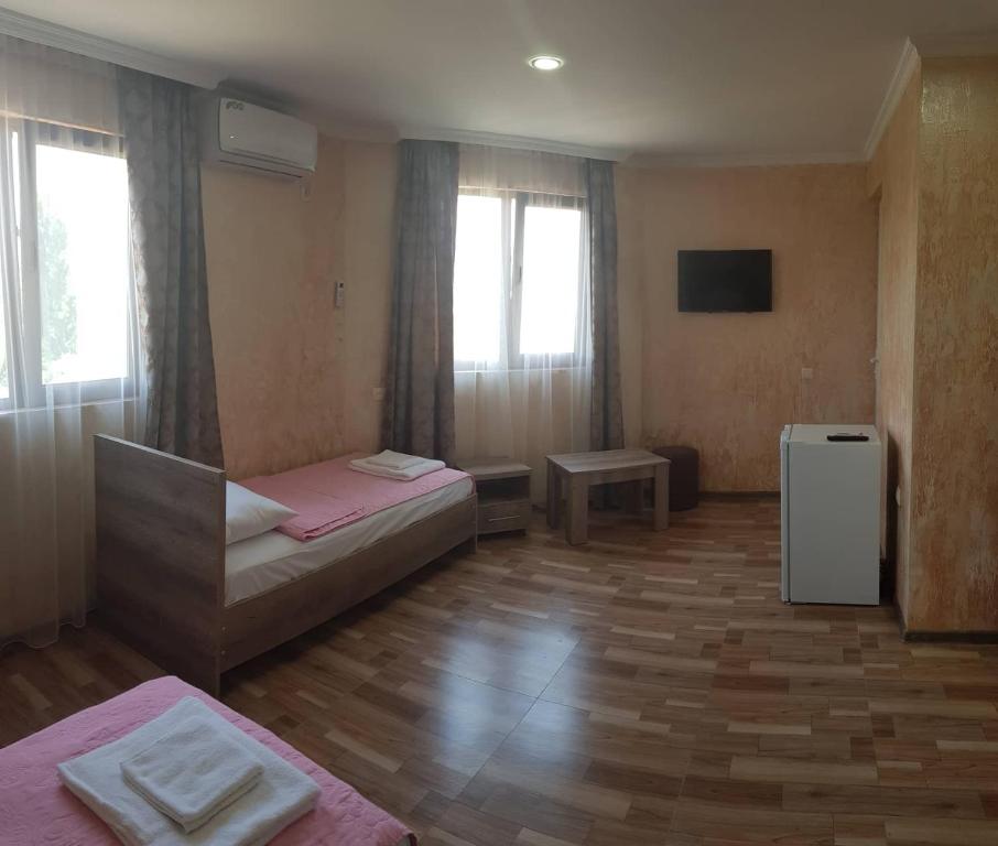 Postel nebo postele na pokoji v ubytování Guest House MARINA
