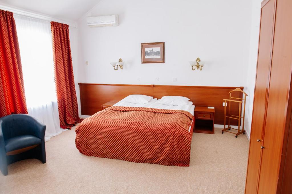 Postel nebo postele na pokoji v ubytování Londonska SPA Hotel