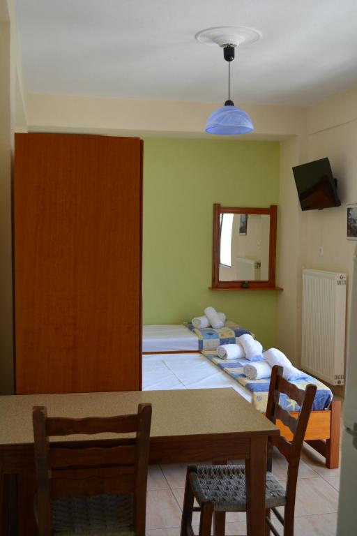 Postel nebo postele na pokoji v ubytování GLIKERIA ROOMS
