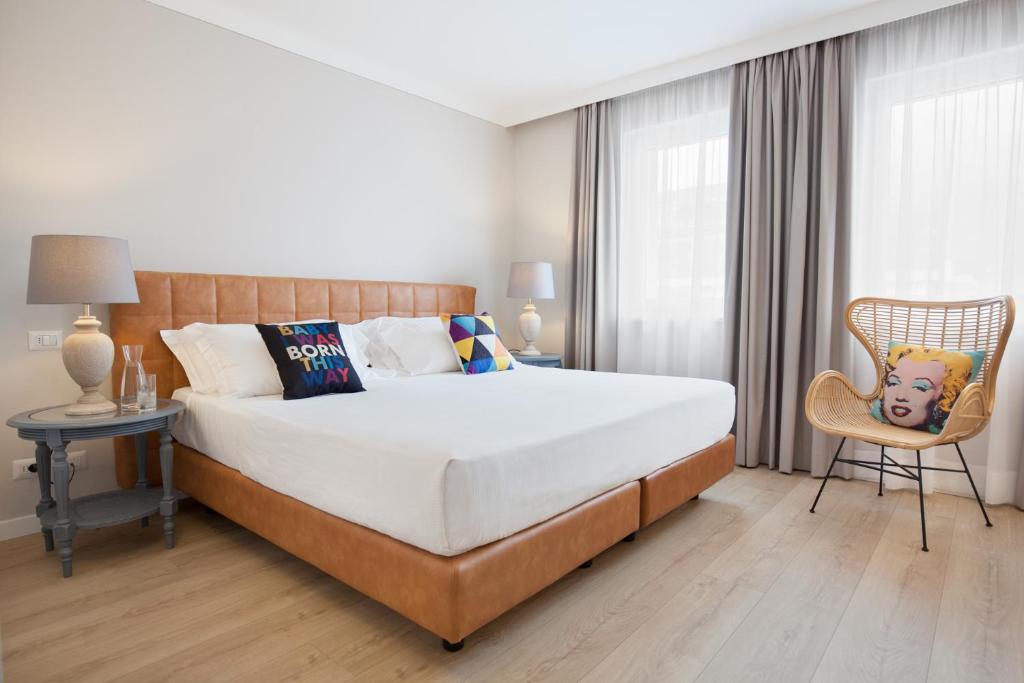 Postel nebo postele na pokoji v ubytování Hotel Leon d'Oro